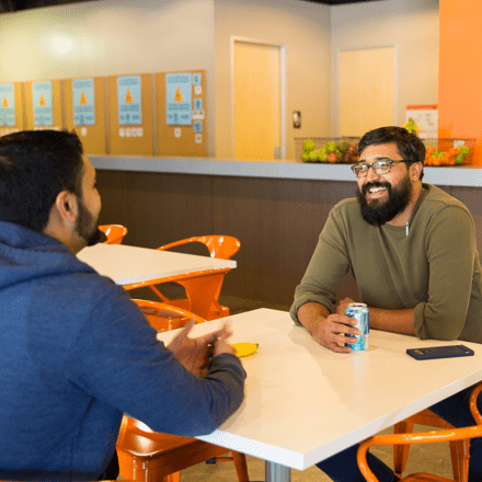 Volusion employees eating in dining area